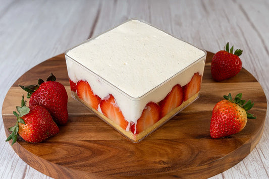 Strawberry shortcake box cake dessert on a wooden table with strawberries